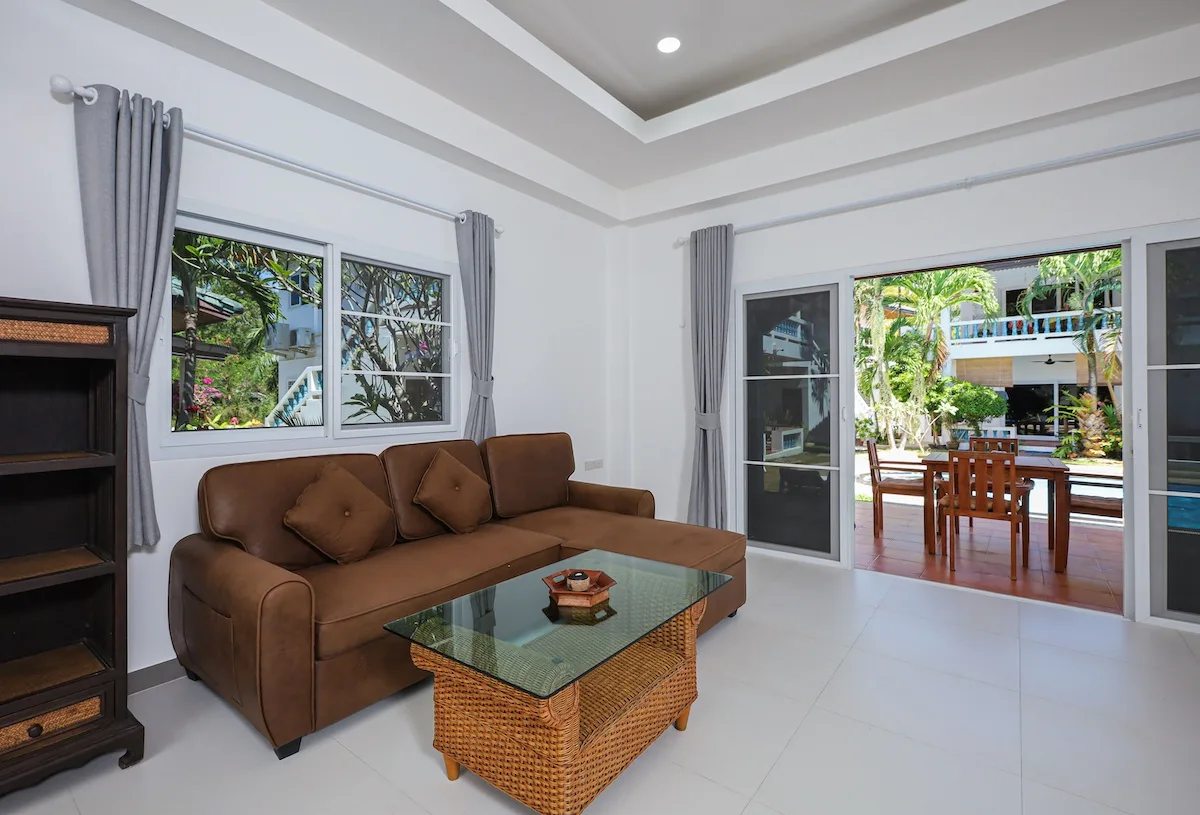 One-bedroom living room with terrace and pool view