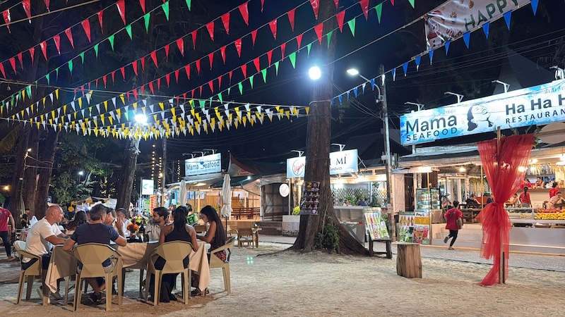 Vibrant night market near Yanui Breeze in Phuket, offering street food, souvenirs, and local products.