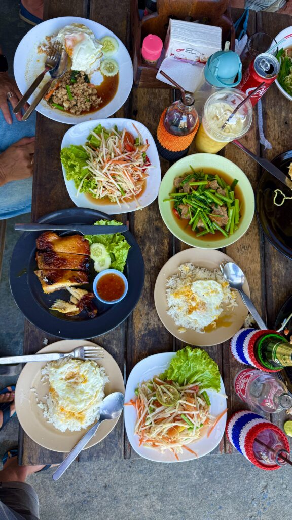 A variety of authentic Thai dishes, including curry, stir-fried vegetables, grilled seafood, and fresh salads.